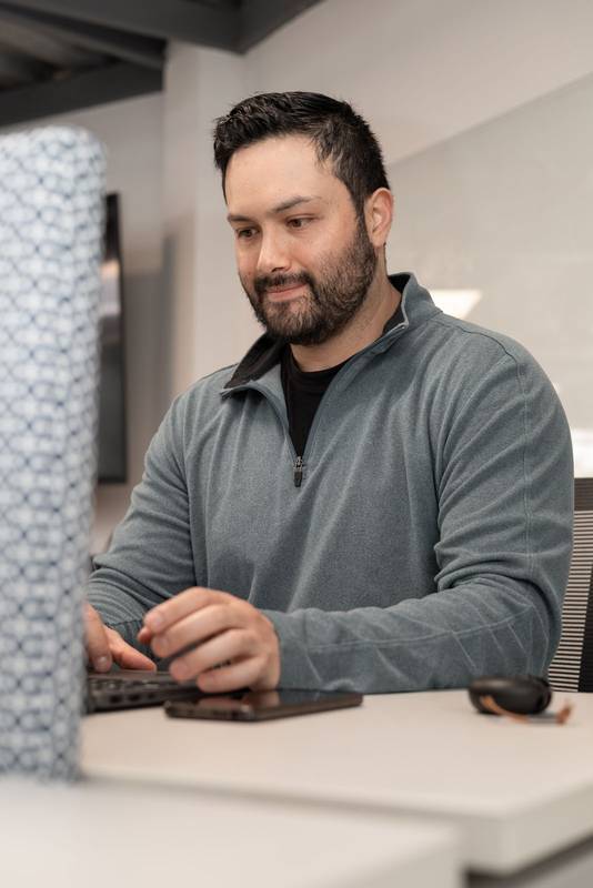 freelancer refines a pitch deck for a client while enjoying the calm and creative vibe