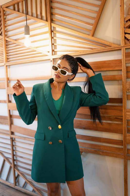 playing with her hair styled in a ponytail, young latin woman