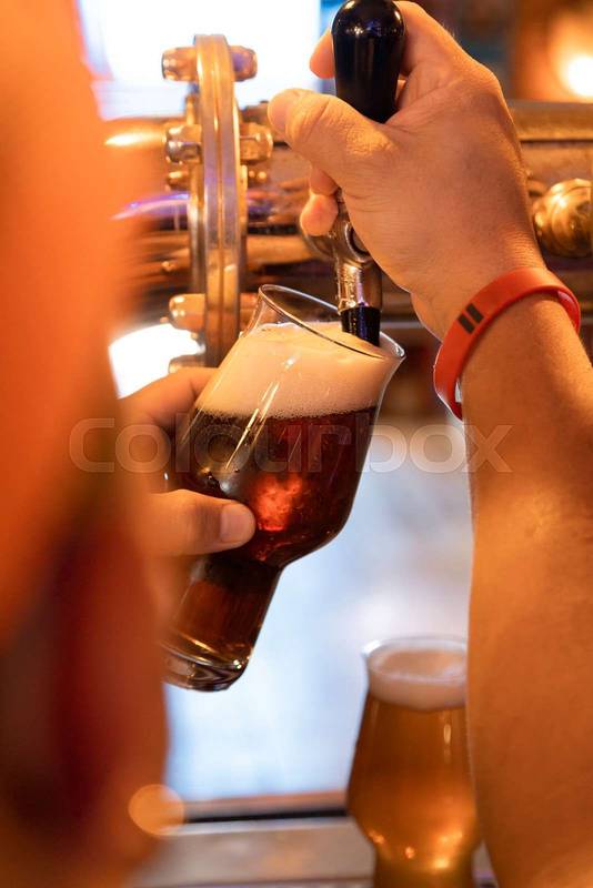bartender serving craft beer, drink in a restaurant
