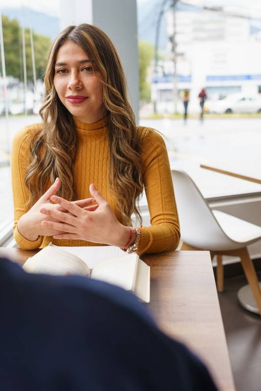 smiling and explaining young woman