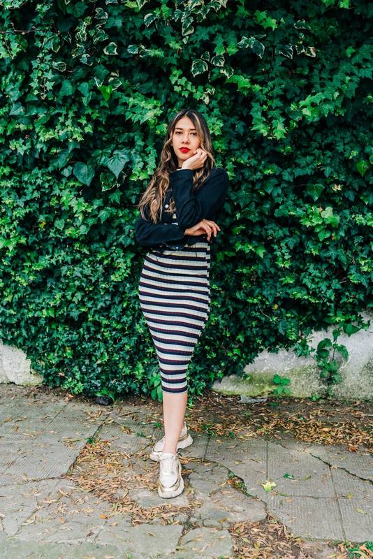 beautiful, young latin woman with long blonde hair, wear makeup, red lips, casual dress