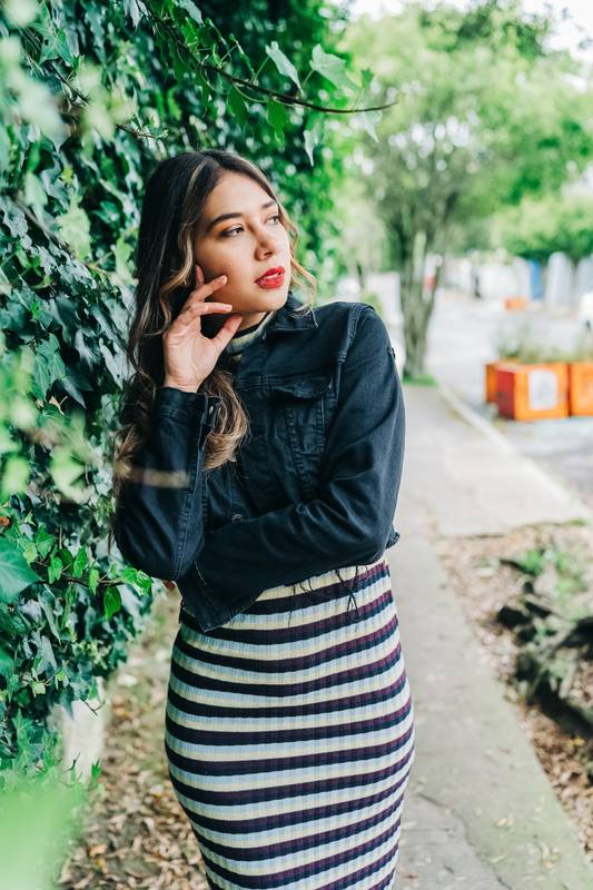 latin woman with long blonde hair, wearing long casual dress with a jacket, fashion