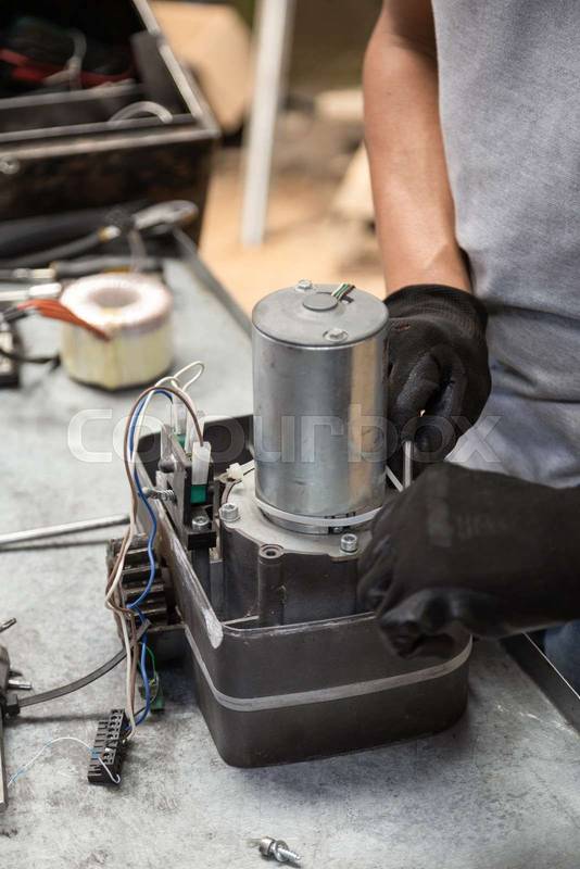 repairing a metal object that is on his workplace, technology and equipment restoration