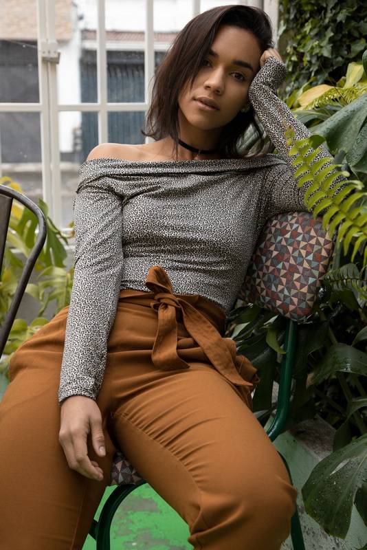 latin female model with short hair, she is resting and posing