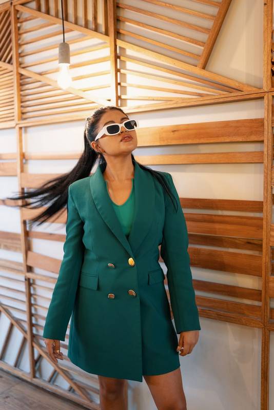 latin woman wears a stylish jacket, sunglasses as an accessory, lifestyle, fashion