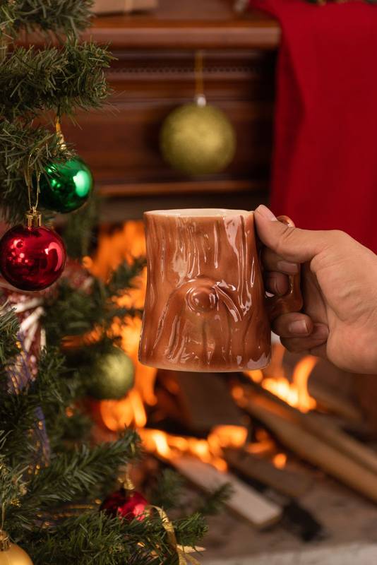 holding a glass cup with wood texture, original and delicate objects