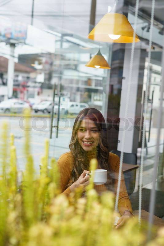 woman enjoying a cup of coffee, modern lifestyle, model joy with elegant decoration