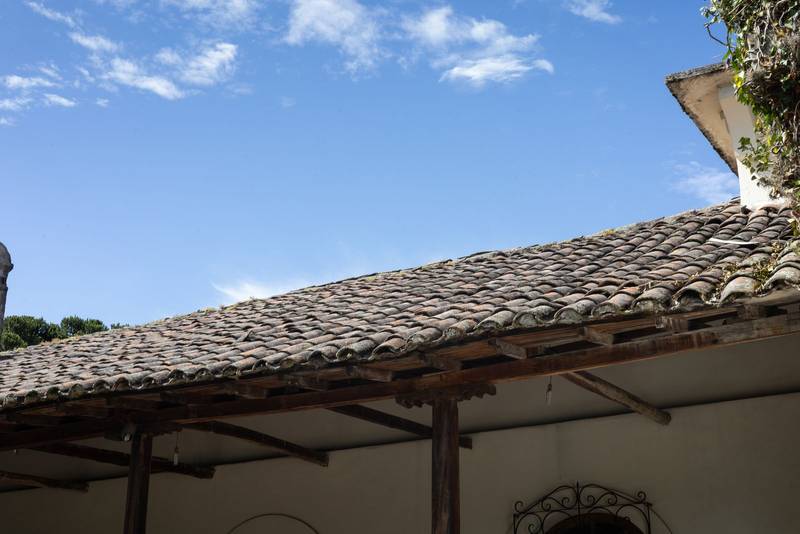 colonial hacienda roof in Ecuador, showing rustic clay tiles and architectural